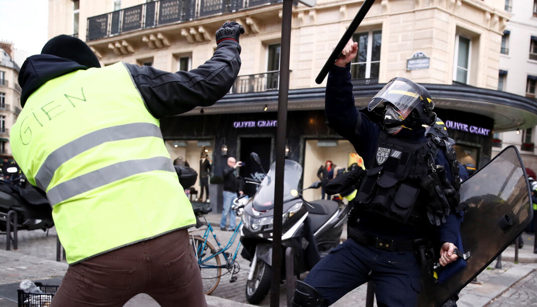 Politiet og demonstranter i håndgemeng under protester i Paris. Foto: Reuters / NTB scanpix Politiet og demonstranter i håndgemeng under protester i Paris. Foto: Reuters / NTB scanpix