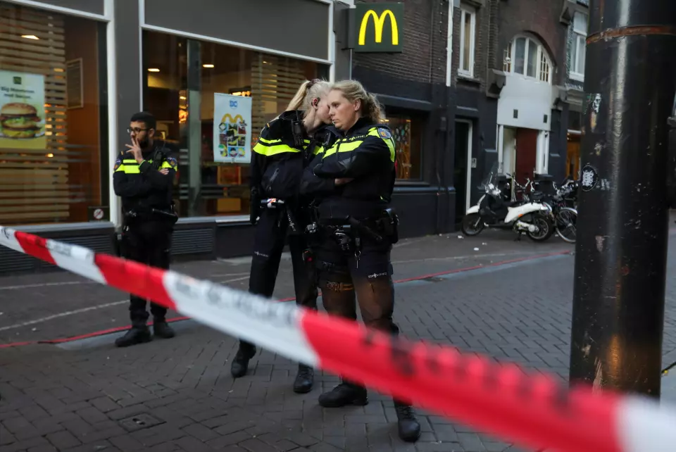 Police officers stand guard to secure the area where Dutch celebrity crime reporter Peter R. de Vries, known for his reporting on some of the most renowned criminals in the Netherlands, was reportedly shot and seriously injured, in Amsterdam, Netherlands, July 6, 2021. REUTERS/Eva Plevier