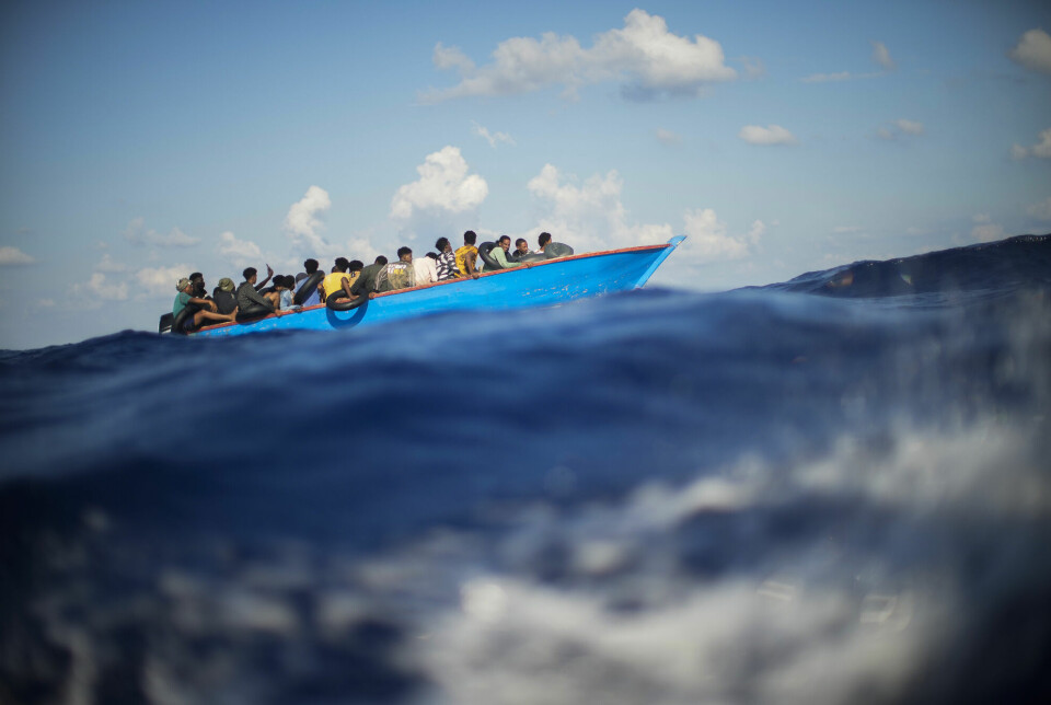 Illustrasjonsbilde: Migranter i en trebåt in Middelhavet sør for den italienske øya Lampedusa i 2022.